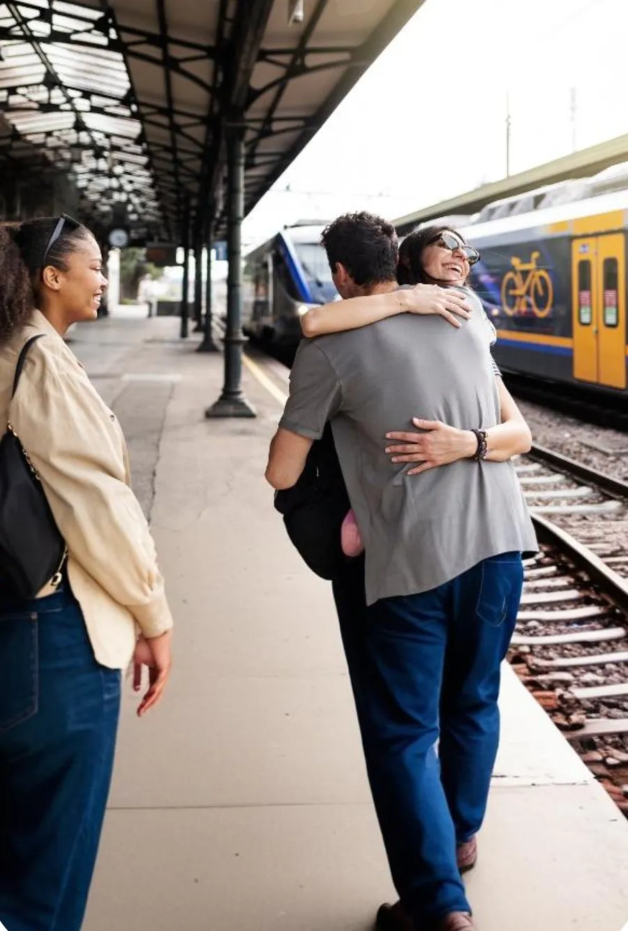 Friends meeting at a train station
